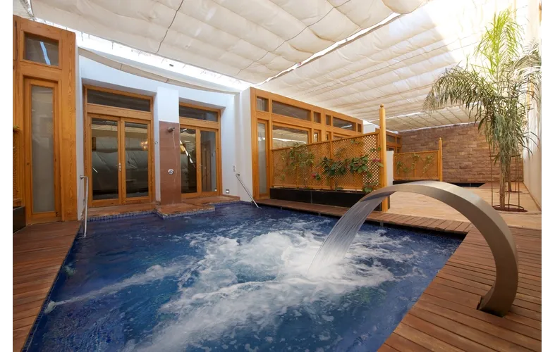 Luxury spa and wellness centre with indoor jacuzzi at PHG properties